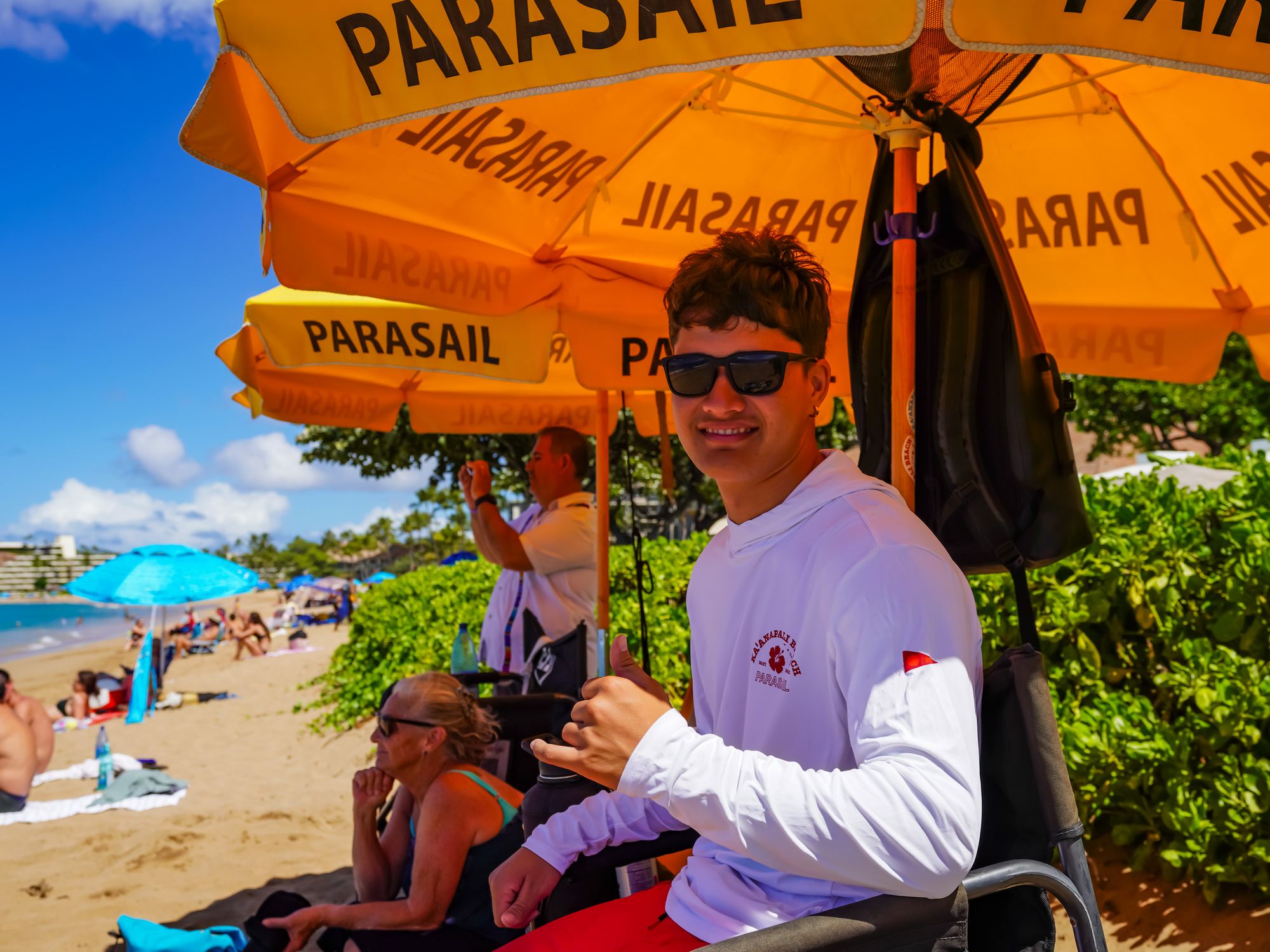 Crew under the PARASAIL umbrellas on Kāʻanapali Beach